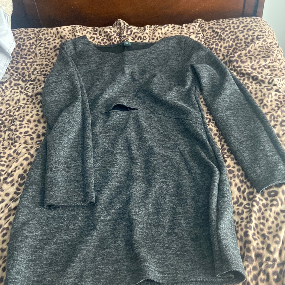 Long sleeve short dress with slit above belly area. Super cute